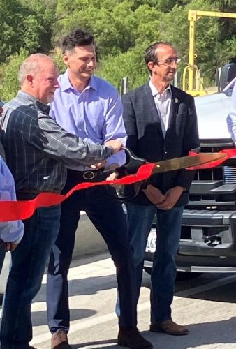 3 Hills Ferry Ribbon Cutting Placing the Scissors